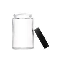 5 ounce V2 flush mount, child-resistant packaging, transparent glass base, cylindrical design.