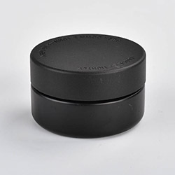 1 ounce V2 flush mount, child-resistant packaging, transparent glass base, cylindrical design.