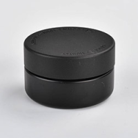 1 ounce V2 flush mount, child-resistant packaging, transparent glass base, cylindrical design.