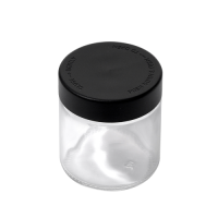3 ounce V2 flush mount, child-resistant packaging, transparent glass base, cylindrical design.