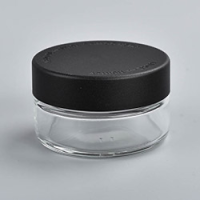 1 ounce V2 flush mount, child-resistant packaging, transparent glass base, cylindrical design.