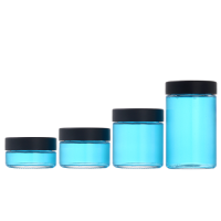 1 ounce V2 flush mount, child-resistant packaging, transparent glass base, cylindrical design.