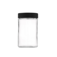 5 ounce V2 flush mount, child-resistant packaging, transparent glass base, cylindrical design.